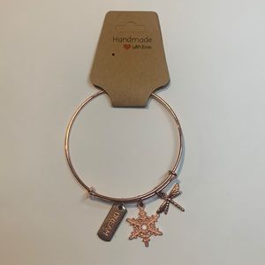 Handmade rose gold stainless steel bracelet with 3 charms.